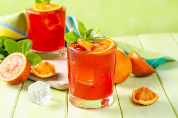 Bloody orange drink and ingredients, copy space