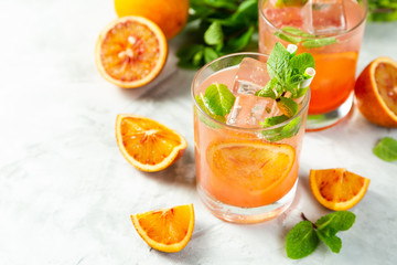 Bloody orange drink and ingredients, copy space