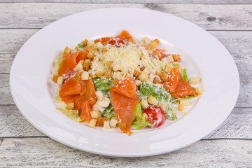 Caesar salad with salmon and parmesan