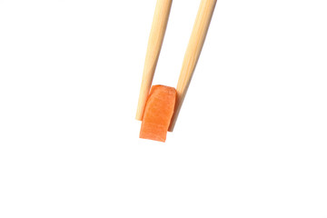 Chopsticks with a circle of ripe carrots isolated on white background.