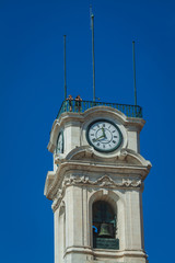 Clock tower of university of Coimbra with tourists