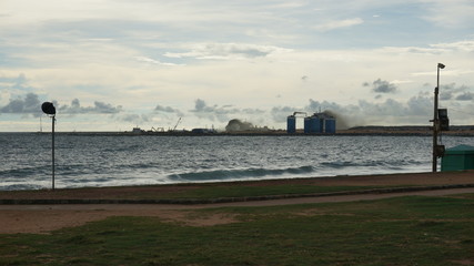 An artificial island is raised on a construction site in the sea