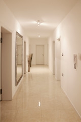 hallway with large wall mirror