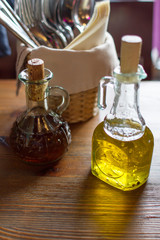 bottle of olive oil  on wooden table