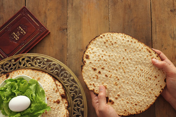 Pesah celebration concept (jewish Passover holiday). Traditional book with text in hebrew: Passover Haggadah (Passover Tale)