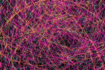 Colorful light painting abstract long exposure image with pink, blue, red and yellow lines on a black background