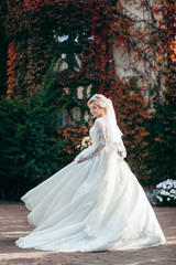 Fototapeta na wymiar Portrait of a young beautiful bride with a bouquet
