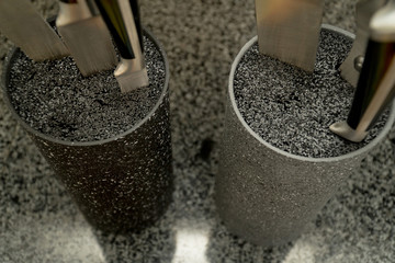 Set of kitchen knives in a two stands