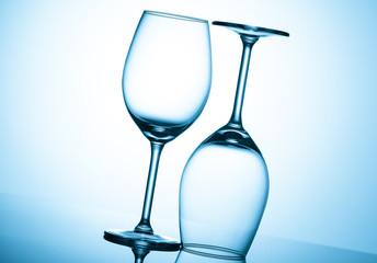 Glasses with water on blue background
