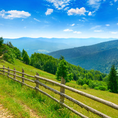 Fototapeta na wymiar View of mountain meadows and blue sky in Carpathians.