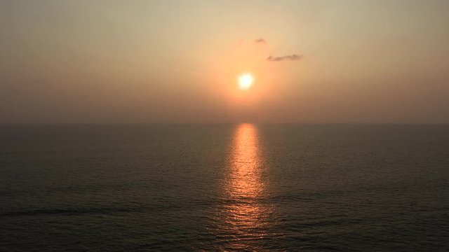 sunset at a holiday resort beach with beautiful clors of sky, beach and reflection on the water in Colombo Sri Lanka