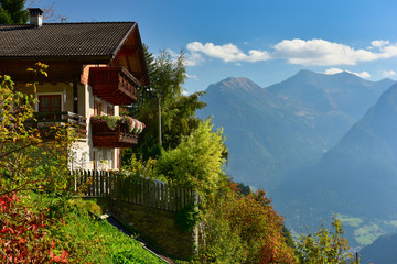 Country house built on a mountainside overlooking the Alps. Stulles, South Tyroles, Italy.