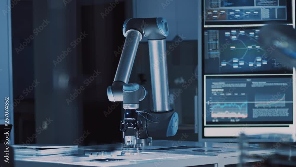 Poster futuristic artificial intelligence robotic arm operates and moves a metal object, picks it up and pu