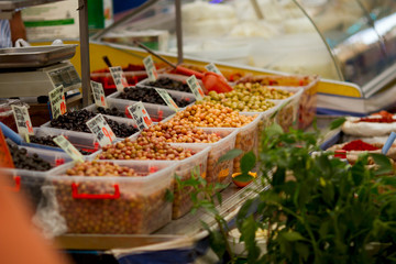 Different varieties of olives on display at farmer's market