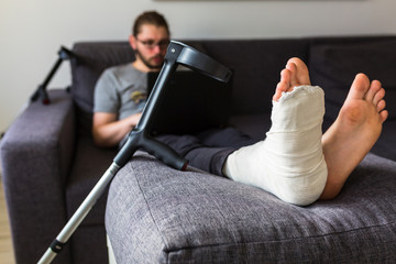 man with a broken leg is surfing the internet
