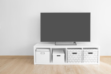 Lcd tv on white shef at modern room interior
