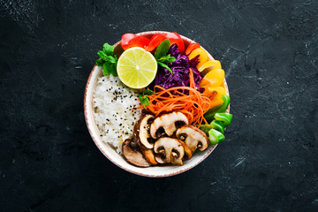 Bowl Buddha Rice with mushrooms, paprika, cabbage, and lime. Top view. free space for your text.