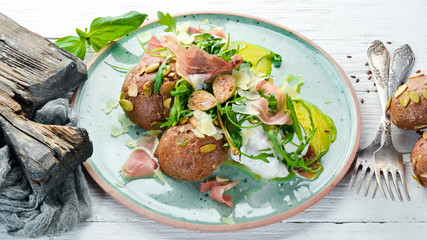 Sandwich with proshutto, egg and arugula. Breakfast. In the plate. Top view. Flat lay composition Free copy space.