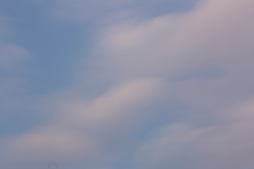 Teal Blue Sky at Sunset with White and Orange Clouds