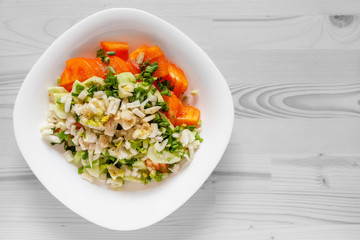 vitamin salad of tomatoes, celery stalks, fennel and green onions seasoned with black pepper and spicy herbs