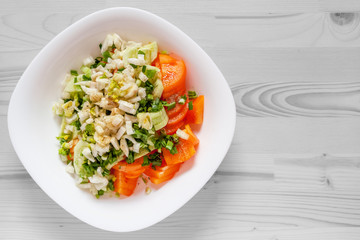 vitamin salad of tomatoes, celery stalks, fennel and green onions seasoned with black pepper and spicy herbs