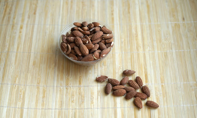 Healthy food  for background image close up almond nuts. Texture Nuts on the cup plate