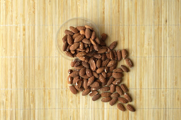 Healthy food  for background image close up almond nuts. Texture Nuts on the cup plate