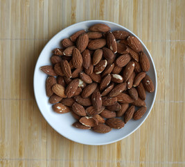 Healthy food  for background image close up almond nuts. Texture Nuts on the cup plate
