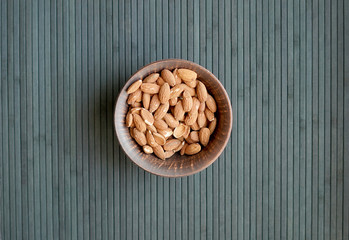 Healthy food  for background image close up almond nuts. Texture Nuts on the cup plate