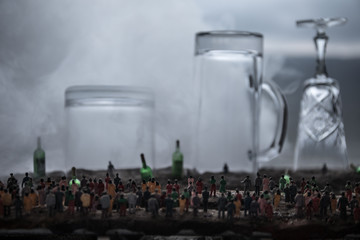 Iron handcuffs for the arrest of criminals, a glass of vodka on a wooden. background. a crime...