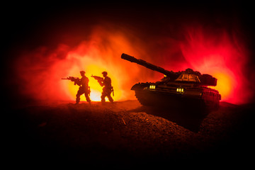 War Concept. Military silhouettes fighting scene on war fog sky background, World War German Tanks...