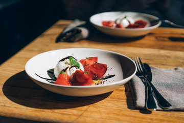 barrata and tomatoes on a plate
