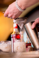 barman preparing cocktail in a cocktail bar