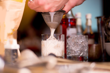 barman preparing cocktail in a cocktail bar