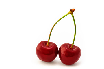 leckere Kirschen vor weißem Hintergrund