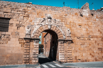 View of The Portal de Sant Antoni gate on the wall of Tarragona. It was built in 1737 and over the arch is the coat of arms of King Philip V of Spain.Part of The Archaeological Ensemble of Tarraco