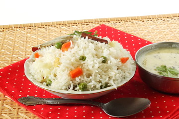Indian food vegetable traditional cooked pulav rice or Basmati rice biryani with kadhi