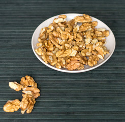 Healthy food  for background image close up walnuts.  Nuts  texture on top view on the cup plate