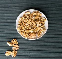 Healthy food  for background image close up walnuts.  Nuts  texture on top view on the cup plate