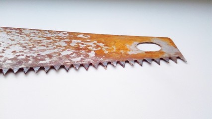 rusty saw on white background
