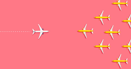 Toy airplanes opposing each other overhead view flat lay