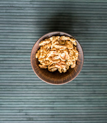 Healthy food  for background image close up walnuts.  Nuts  texture on top view on the cup plate