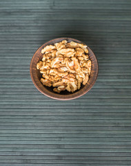 Healthy food  for background image close up walnuts.  Nuts  texture on top view on the cup plate