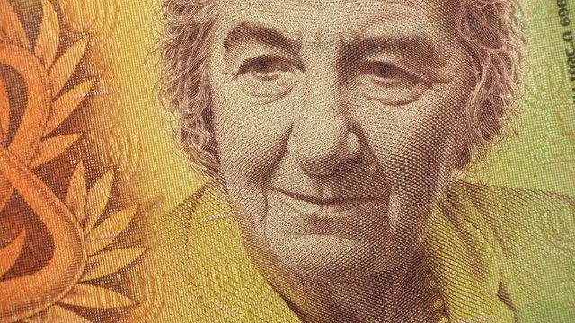 Golda Meir on old Israeli banknote close up rotating. Prime minister of Israel. 4K stock video footage