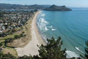 Elevated view of Pauanui township and beach, with Tairua and Mount Paku in the background. Coromandel Peninsula, New Zealand. - obrazy, fototapety, plakaty