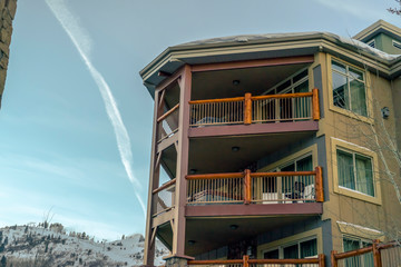 Home against snowy mountain and sky in Park City