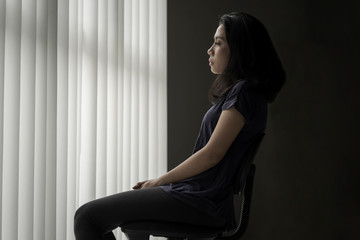 Sad woman sitting on the chair