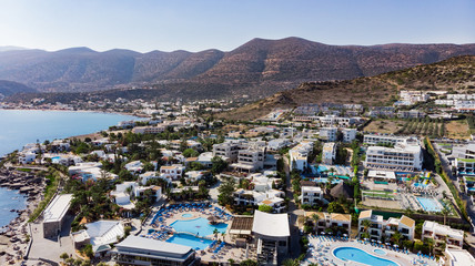 Fototapeta na wymiar Hersonissos Crete, Greece. Panoramic view from above. Summer sea and tourism on the coast of Greece