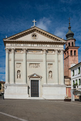 white church with columns and green door, Duomo Cittadella, Italy