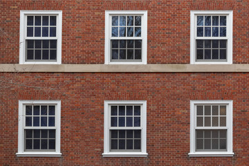 Fototapeta na wymiar college windows on brick wall